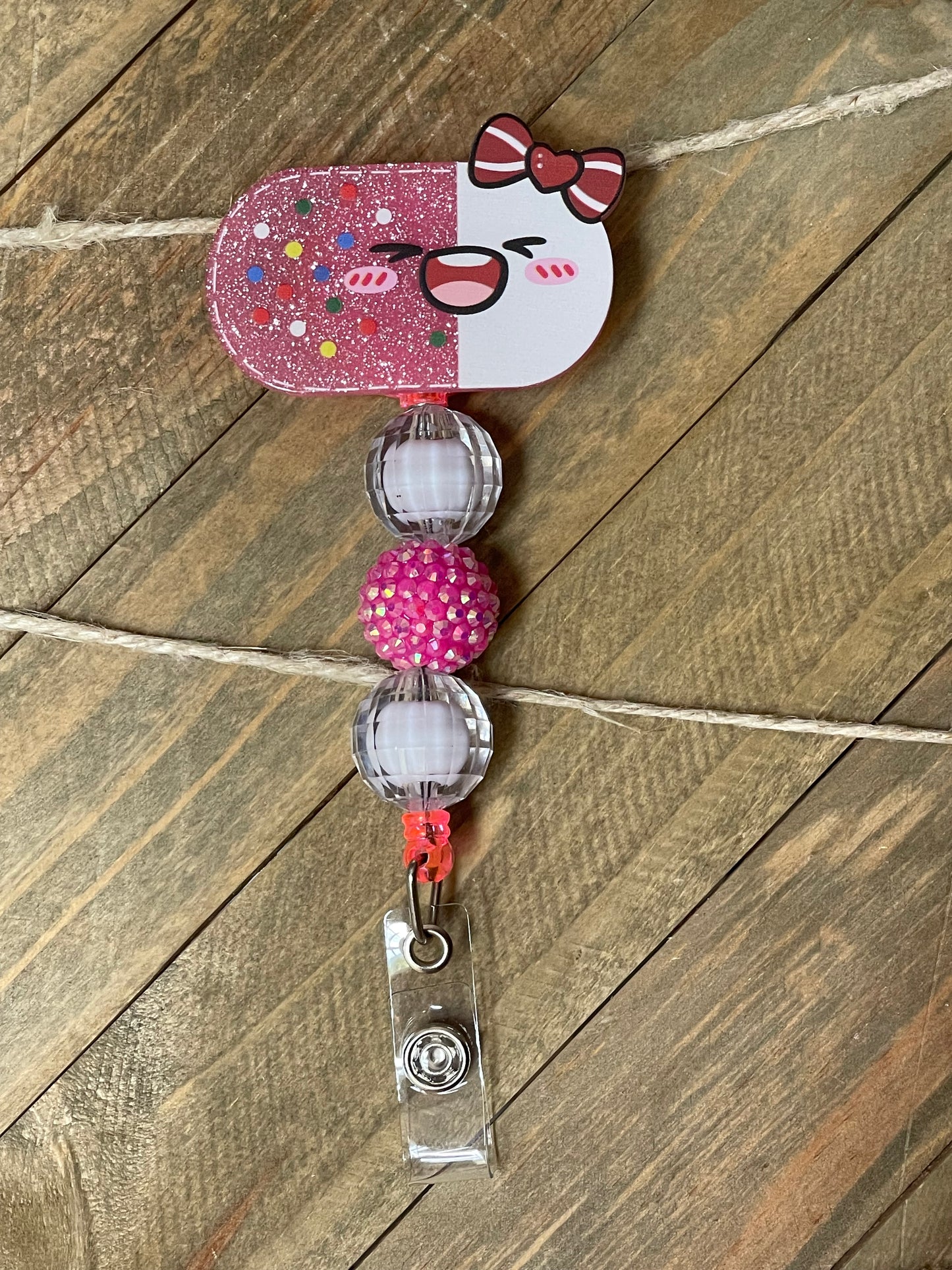 Smiling Pill Badge Reel