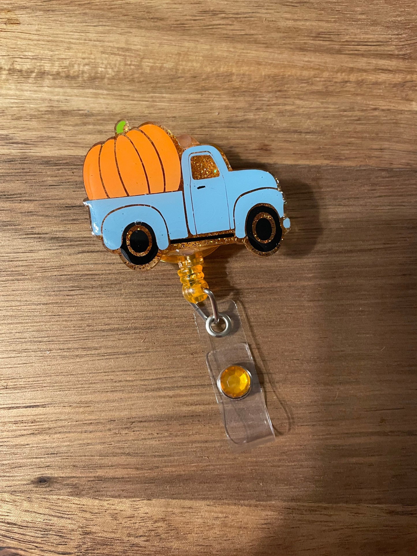 Vintage Pumpkin Truck Badge Reel